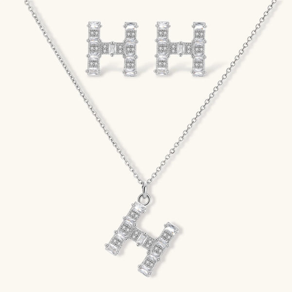 Letter H jewelry set featuring geometric crystal design in gold and white gold plated finish with adjustable chain necklace