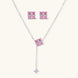White gold plated jewelry set with pink cubic zirconia stones in geometric cross design, featuring Y-necklace and square stud earrings