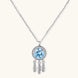 Sterling silver dreamcatcher pendant with blue moissanite center and three feather charms on adjustable chain.