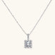 Square moissanite pendant with halo setting on delicate sterling silver chain against white background.