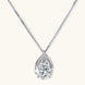 Sterling silver necklace featuring a large pear-shaped moissanite stone in an ornate setting with smaller accent stones