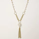 Long gold-plated necklace with freshwater pearls, chunky chain links, and flowing tassel pendant