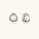 Triangular white gold plated stud earrings with central freshwater pearl and baguette-cut stones on white background