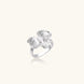 Silver-toned orchid ring with textured petals, pearl center accents, and sparkling zirconia stones on white background.