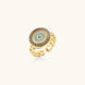 Gold chain ring with Greek key border and turquoise evil eye center on white background